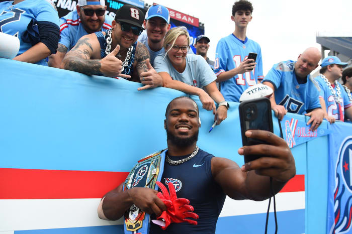 Tennessee Titans linebacker Azeez Al-Shaair (2) takes a selfie with fans before the game against the Atlanta Falcons at Nissan Stadium. Mandatory Credit: Christopher Hanewinckel-USA TODAY Sports